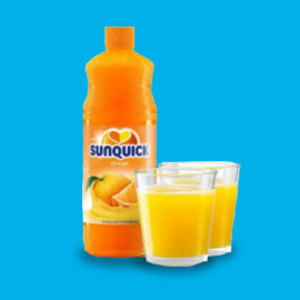 Sunquick concentrate with glasses on blue background